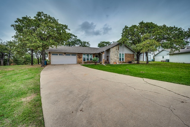 211 Willow Creek Ct, Mansfield, TX 76063 - view of front of house featuring a garage, a front yard, concrete driveway, and brick siding
