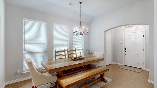 751 Kirby Dr, Argyle, TX 76226 - dining room featuring arched walkways, a chandelier, lofted ceiling, and light tile patterned floors