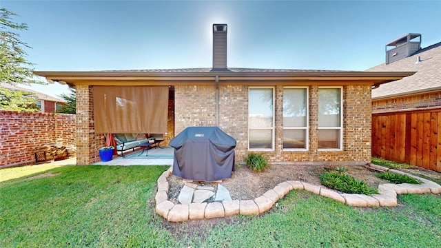 751 Kirby Dr, Argyle, TX 76226 - back of house featuring brick siding, a fenced backyard, and a patio area