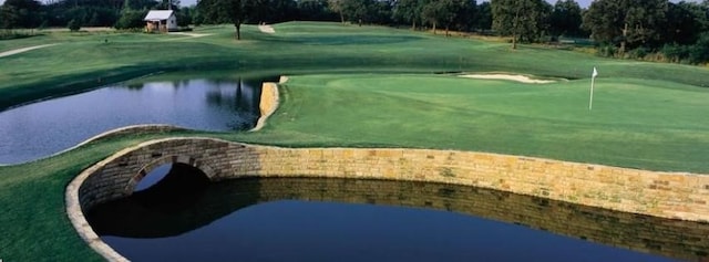751 Kirby Dr, Argyle, TX 76226 - view of home's community featuring a putting area, view of golf course, a water view, and view of scattered trees