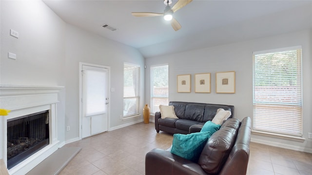 751 Kirby Dr, Argyle, TX 76226 - living area with a ceiling fan, light tile patterned floors, healthy amount of natural light, lofted ceiling, and a fireplace with raised hearth
