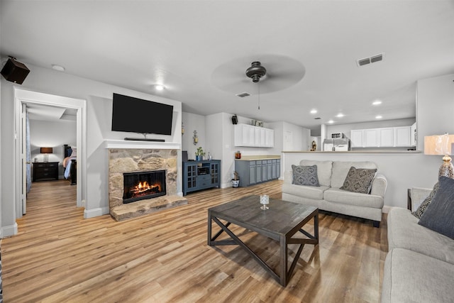 2316 Cavalry Dr, Fort Worth, TX 76177 - living area with ceiling fan, light wood-style floors, a fireplace, and recessed lighting