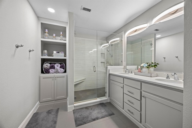 2316 Cavalry Dr, Fort Worth, TX 76177 - bathroom with double vanity, a shower stall, and tile patterned floors