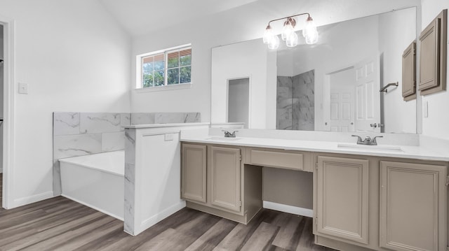 836 Snapdragon Ln, Plano, TX 75075 - full bath featuring double vanity, a bath, wood finished floors, vaulted ceiling, and a marble finish shower