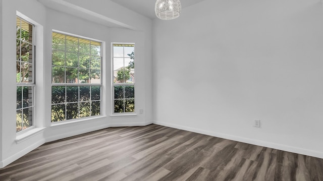 836 Snapdragon Ln, Plano, TX 75075 - empty room with a chandelier and wood finished floors