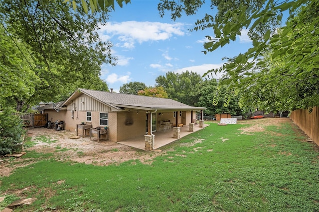 4204 Shipley Ct, Benbrook, TX 76116 - back of house with brick siding, a patio area, a shed, a fenced backyard, and a shingled roof