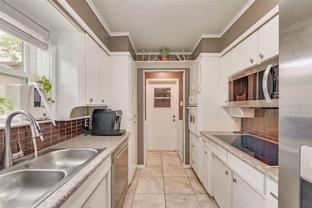 4204 Shipley Ct, Benbrook, TX 76116 - kitchen featuring stainless steel appliances, white cabinetry, crown molding, light countertops, and decorative backsplash