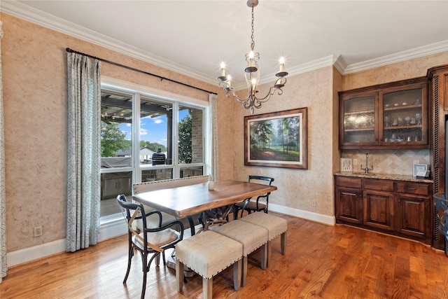 229 Lakeside Dr, Malakoff, TX 75148 - dining room featuring a chandelier, wood finished floors, and ornamental molding