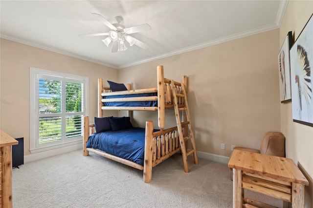 229 Lakeside Dr, Malakoff, TX 75148 - carpeted bedroom with ornamental molding and a ceiling fan