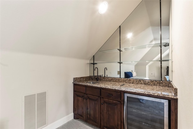 229 Lakeside Dr, Malakoff, TX 75148 - indoor wet bar featuring beverage cooler and vaulted ceiling