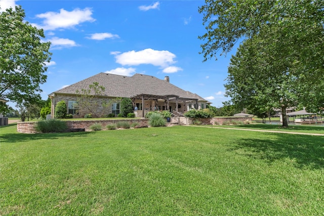 229 Lakeside Dr, Malakoff, TX 75148 - rear view of house featuring a pergola, a yard, a chimney, and stone siding