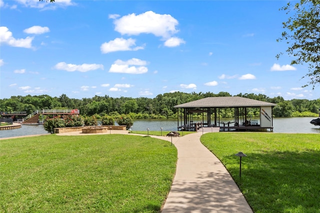 229 Lakeside Dr, Malakoff, TX 75148 - view of community featuring a lawn, a water view, and a boat dock