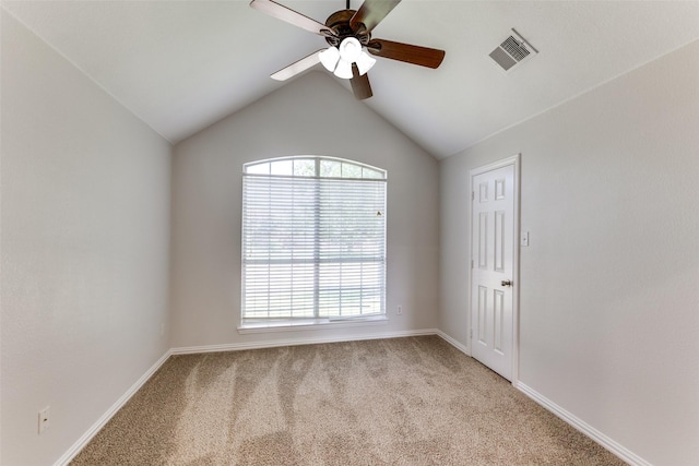 426 Bell Dr, Wylie, TX 75098 - empty room featuring a ceiling fan, light carpet, plenty of natural light, and vaulted ceiling