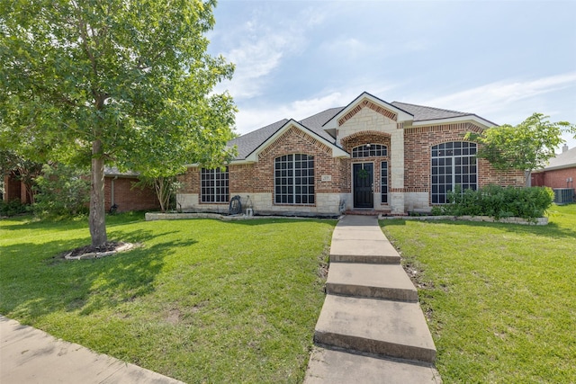 426 Bell Dr, Wylie, TX 75098 - view of front of property featuring brick siding, a front lawn, and stone siding