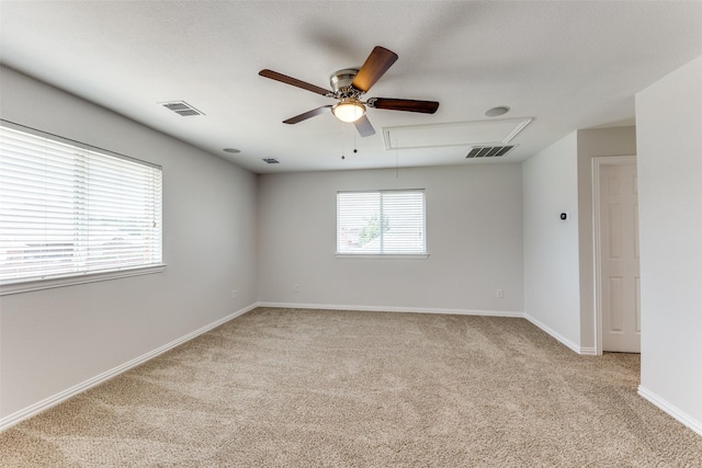 426 Bell Dr, Wylie, TX 75098 - spare room with attic access, light carpet, and ceiling fan