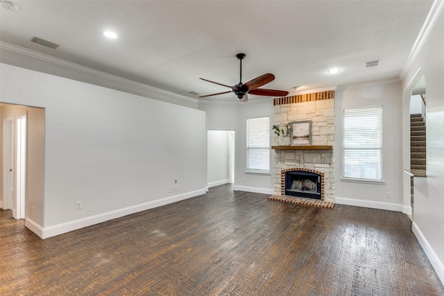 426 Bell Dr, Wylie, TX 75098 - unfurnished living room featuring ceiling fan, plenty of natural light, ornamental molding, a fireplace, and stairs