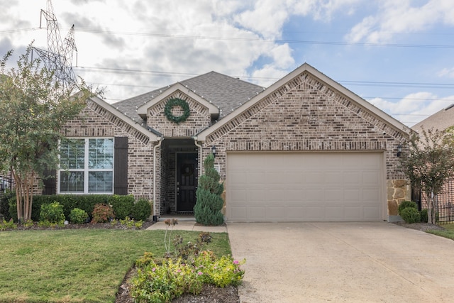 1728 Karma Dr, Wylie, TX 75098 - french provincial home with an attached garage, driveway, brick siding, a front lawn, and roof with shingles