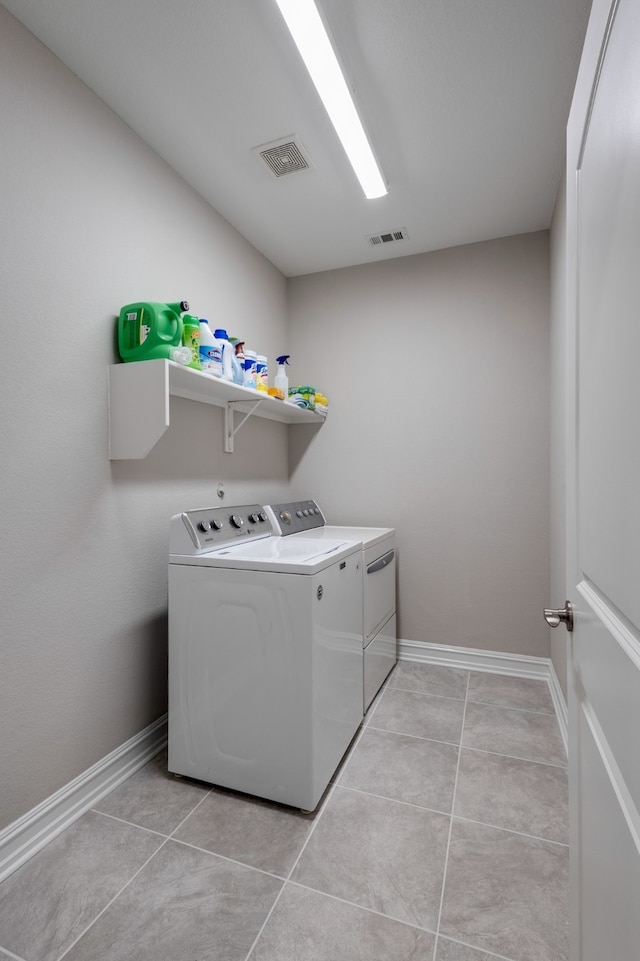 1728 Karma Dr, Wylie, TX 75098 - washroom featuring washer and clothes dryer and light tile patterned floors