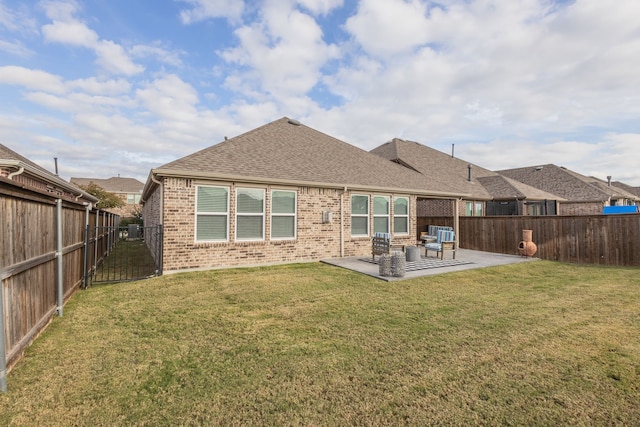 1728 Karma Dr, Wylie, TX 75098 - back of house featuring brick siding, a patio, a fenced backyard, and a shingled roof