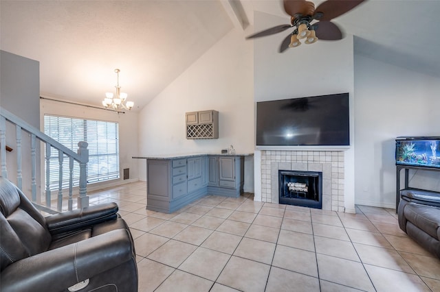 3412 Forest Creek Dr, Fort Worth, TX 76123 - living area featuring high vaulted ceiling, a chandelier, light tile patterned floors, ceiling fan, and a tiled fireplace