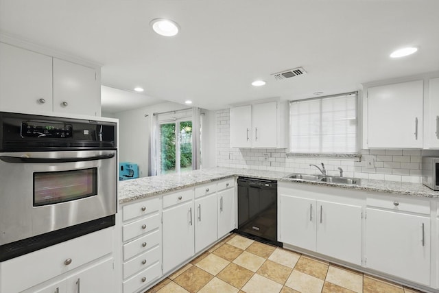 6123 Moonglow Dr, Dallas, TX 75241 - kitchen featuring stainless steel appliances, decorative backsplash, recessed lighting, white cabinets, and light stone countertops