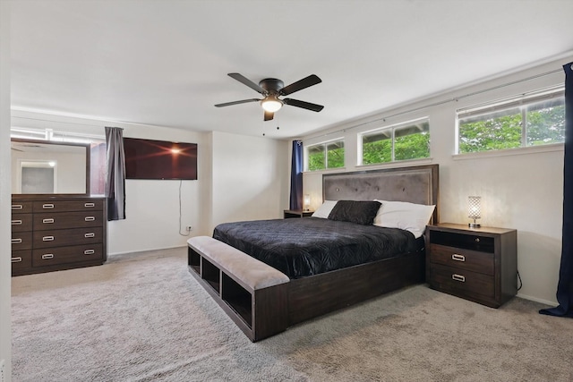 6123 Moonglow Dr, Dallas, TX 75241 - bedroom featuring light colored carpet and ceiling fan