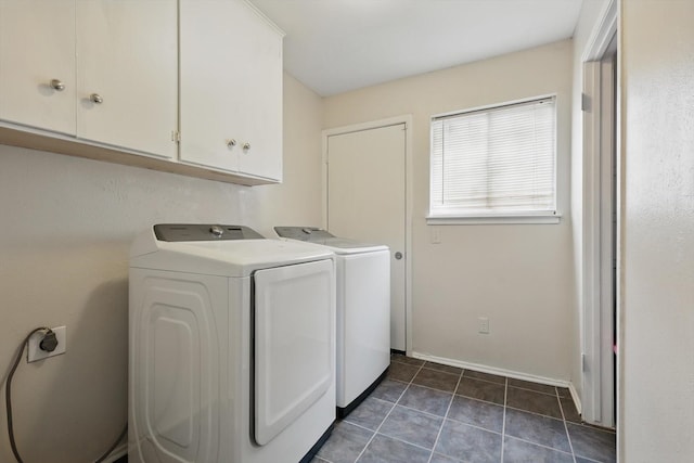 6123 Moonglow Dr, Dallas, TX 75241 - laundry room with cabinet space, separate washer and dryer, and dark tile patterned floors