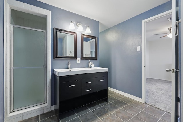 6123 Moonglow Dr, Dallas, TX 75241 - bathroom with double vanity, tile patterned floors, a shower stall, and a ceiling fan