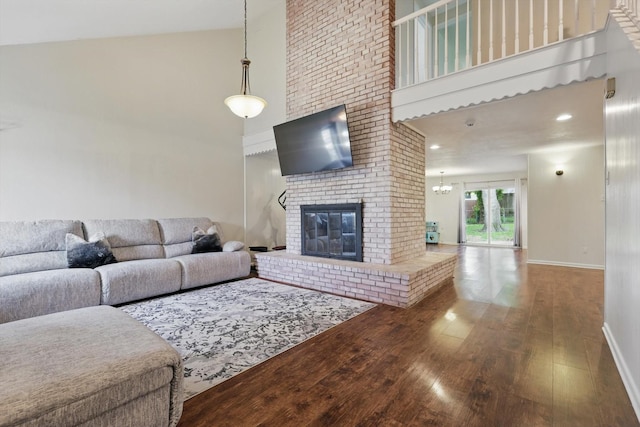 6123 Moonglow Dr, Dallas, TX 75241 - living room with a high ceiling, wood finished floors, and a brick fireplace
