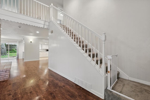 6123 Moonglow Dr, Dallas, TX 75241 - stairs featuring wood finished floors and a high ceiling