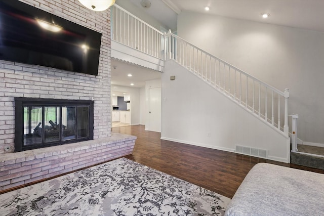 6123 Moonglow Dr, Dallas, TX 75241 - living room featuring wood finished floors, stairs, recessed lighting, and a fireplace