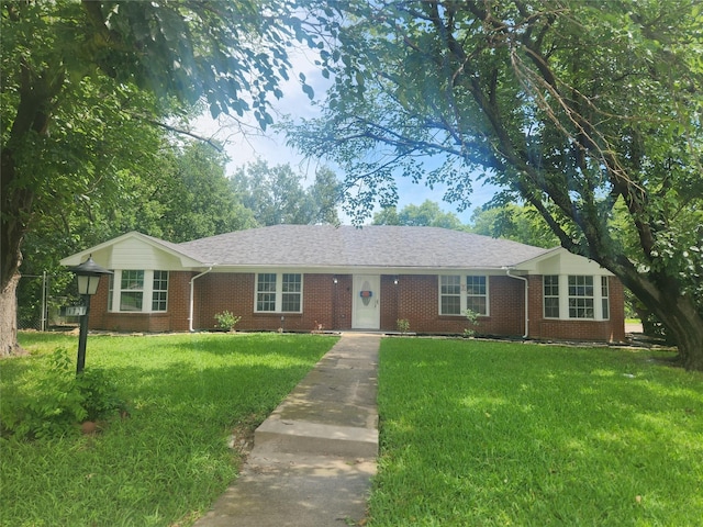 1721 Monaco Dr, Arlington, TX 76010 - ranch-style home featuring brick siding and a front lawn