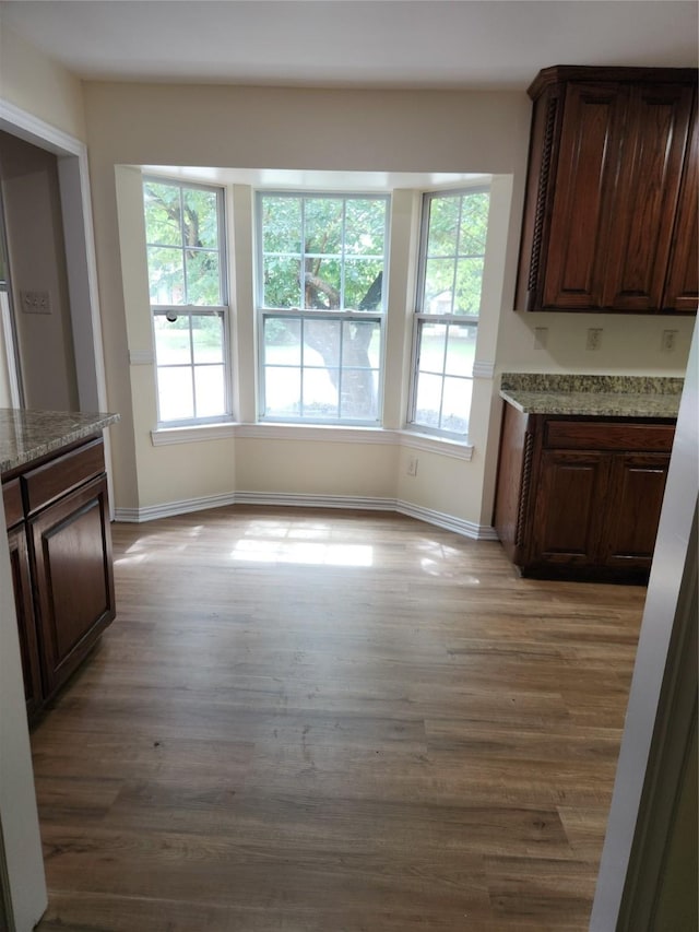 1721 Monaco Dr, Arlington, TX 76010 - unfurnished dining area featuring light wood-type flooring