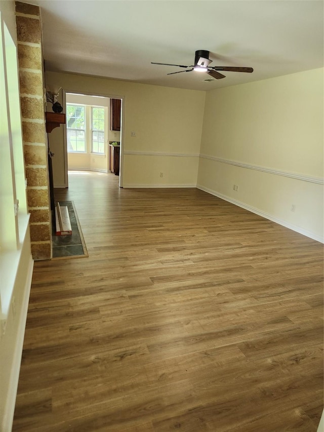 1721 Monaco Dr, Arlington, TX 76010 - empty room with a ceiling fan and wood finished floors