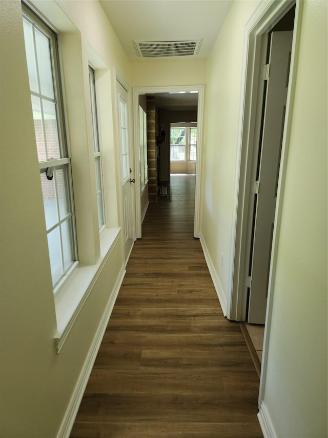 1721 Monaco Dr, Arlington, TX 76010 - hallway with dark wood-style flooring and baseboards