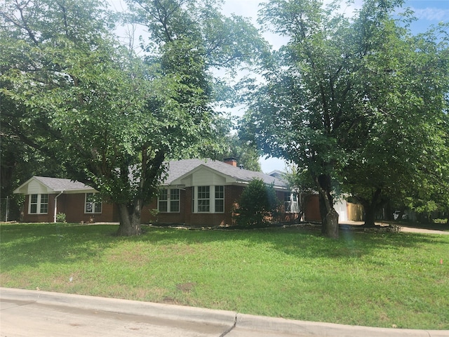 1721 Monaco Dr, Arlington, TX 76010 - single story home featuring a front lawn, a chimney, and brick siding