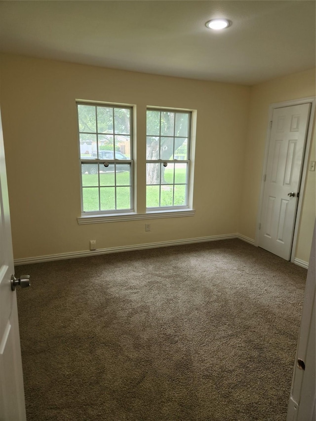 1721 Monaco Dr, Arlington, TX 76010 - unfurnished room with dark carpet and baseboards