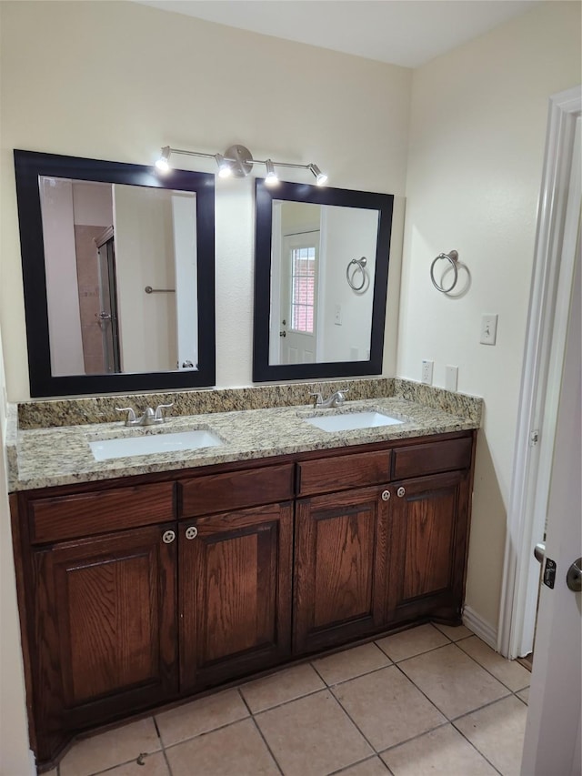 1721 Monaco Dr, Arlington, TX 76010 - bathroom with double vanity and tile patterned floors