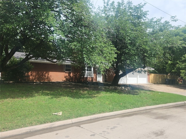 1721 Monaco Dr, Arlington, TX 76010 - view of front facade with concrete driveway and brick siding