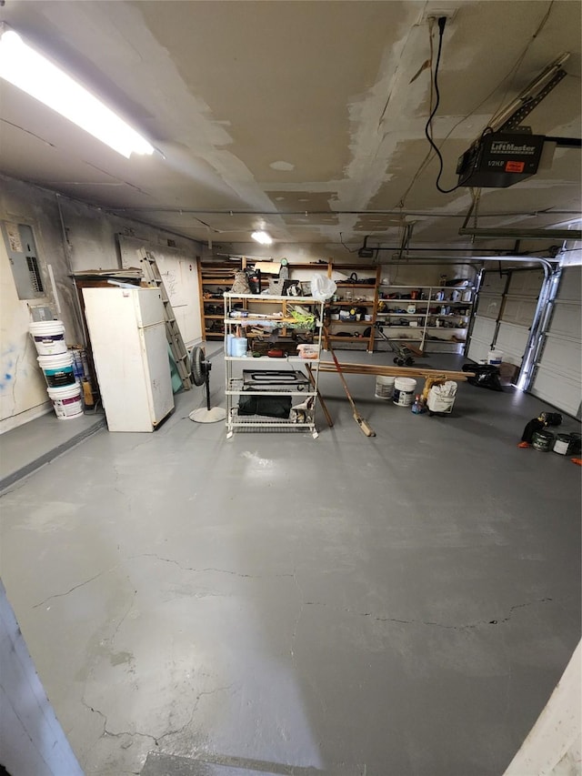 1721 Monaco Dr, Arlington, TX 76010 - garage with freestanding refrigerator, a garage door opener, and electric panel