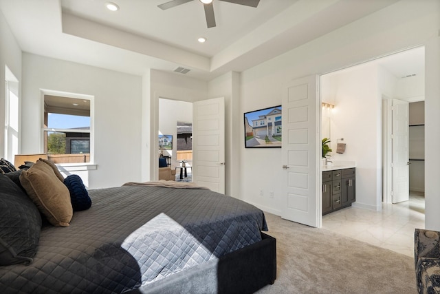 2105 Oak Haven Ct, Garland, TX 75044 - bedroom with recessed lighting, a tray ceiling, ensuite bath, and ceiling fan