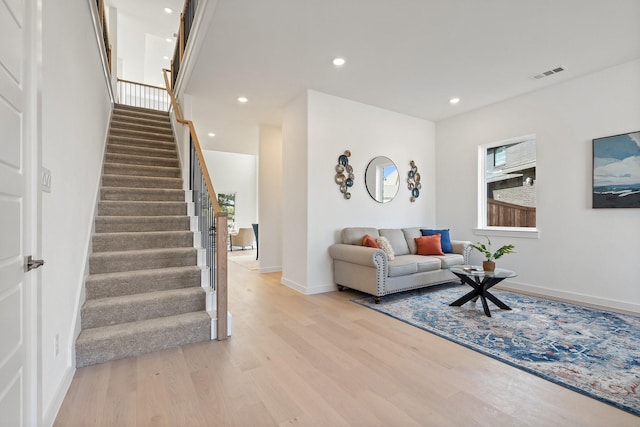 2105 Oak Haven Ct, Garland, TX 75044 - living room with stairs, light wood-type flooring, and recessed lighting