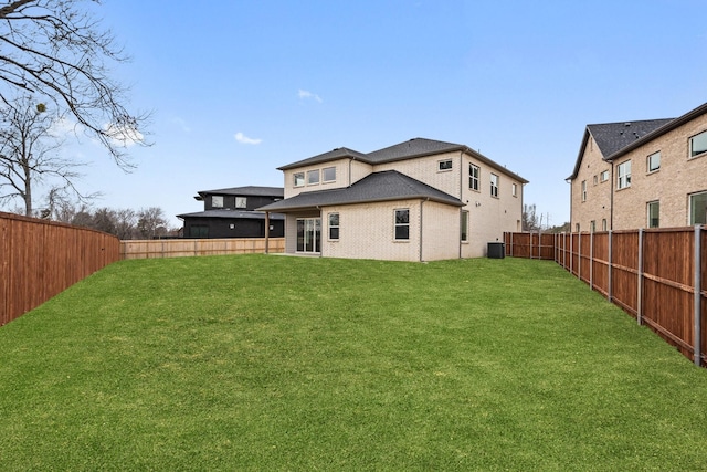 2105 Oak Haven Ct, Garland, TX 75044 - rear view of property featuring a fenced backyard and brick siding