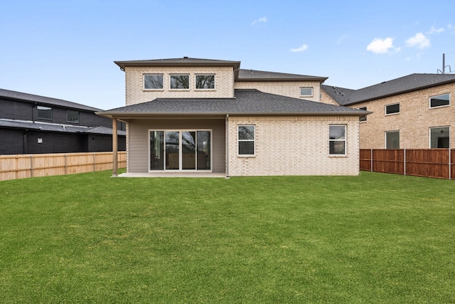 2105 Oak Haven Ct, Garland, TX 75044 - rear view of property with a fenced backyard, brick siding, and a shingled roof