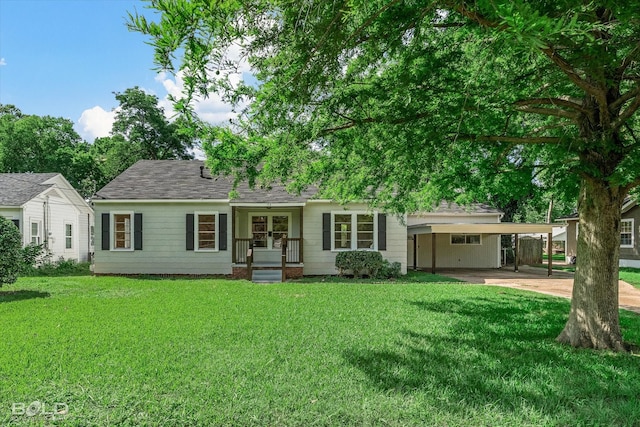 174 Carrollton Ave, Shreveport, LA 71105 - view of front facade with a front lawn, a carport, concrete driveway, and french doors