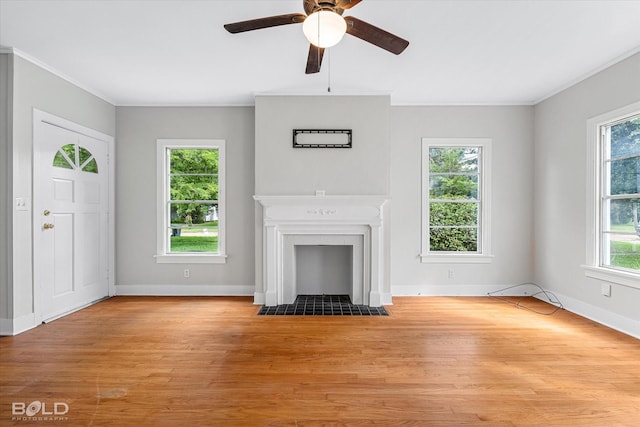 174 Carrollton Ave, Shreveport, LA 71105 - unfurnished living room with a fireplace with flush hearth, wood finished floors, a ceiling fan, and crown molding