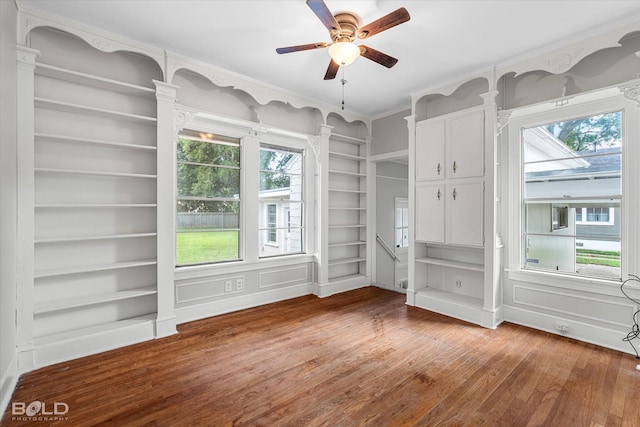 174 Carrollton Ave, Shreveport, LA 71105 - empty room with wood finished floors, ceiling fan, built in features, and healthy amount of natural light