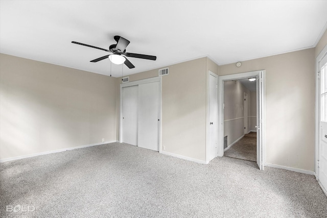 174 Carrollton Ave, Shreveport, LA 71105 - unfurnished bedroom with light carpet, a closet, and a ceiling fan