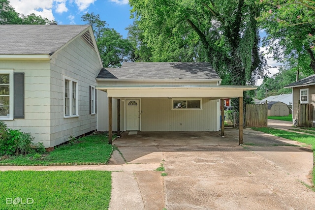 174 Carrollton Ave, Shreveport, LA 71105 - view of front of property with driveway, roof with shingles, and an attached carport