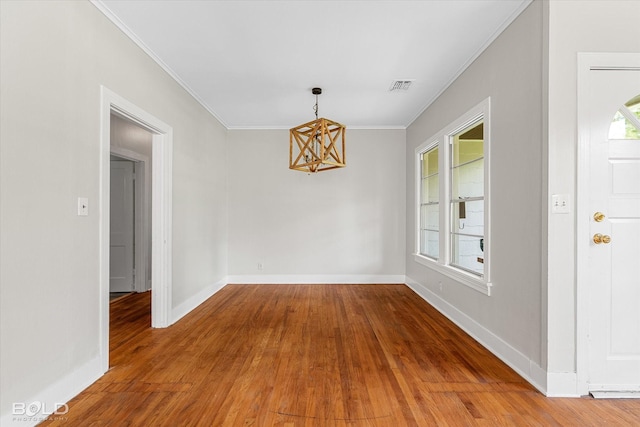 174 Carrollton Ave, Shreveport, LA 71105 - unfurnished dining area featuring a chandelier, wood finished floors, and ornamental molding